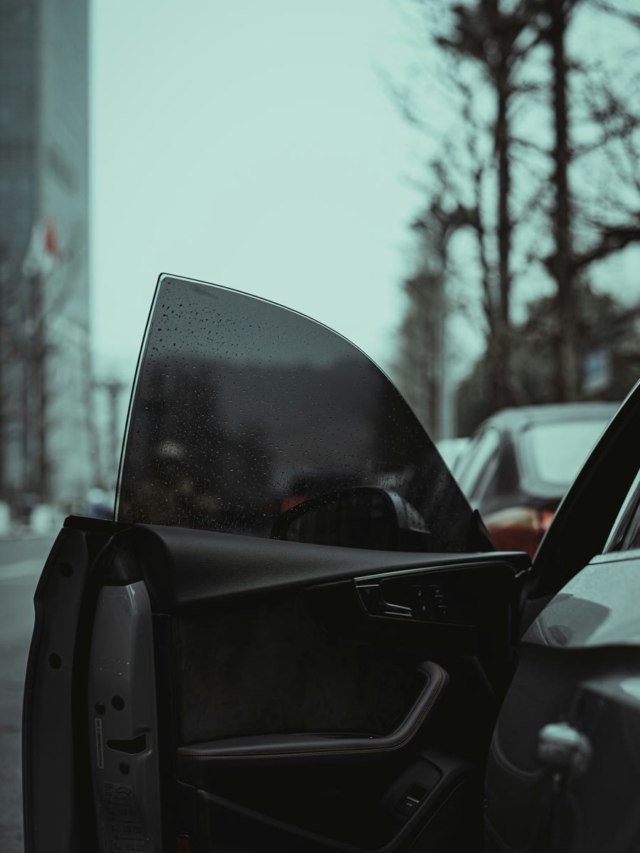 Car tinting Wangara: tint film across the door glass of a work vehicle