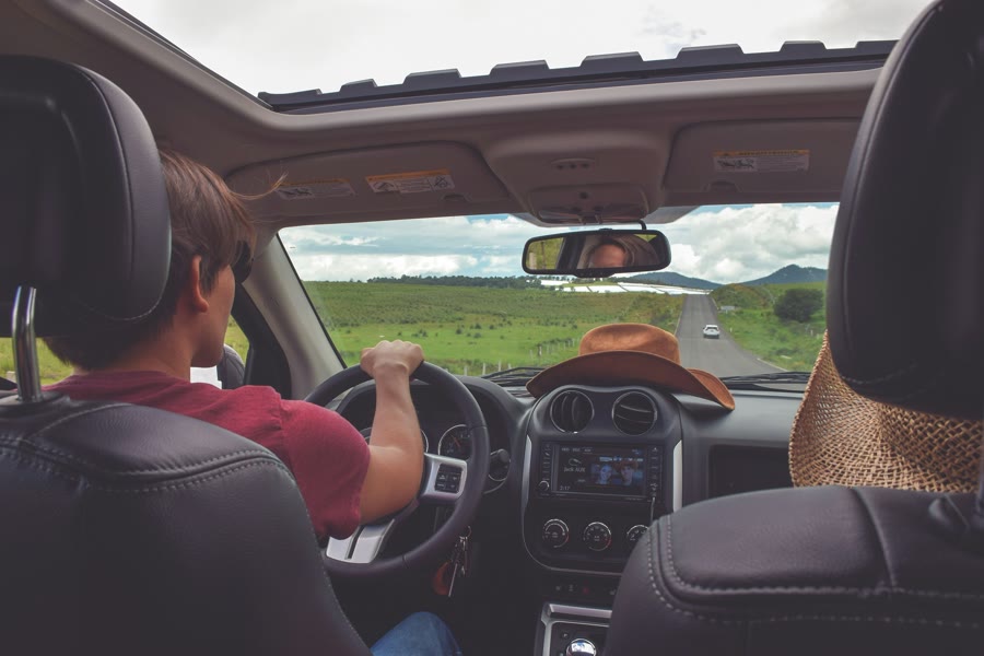 Car window tinting Byford: a driver heading down a sunny open road