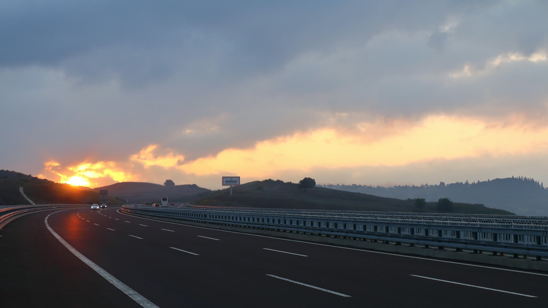Car window tinting Byford: an open highway at sunset with the sun low on the horizon