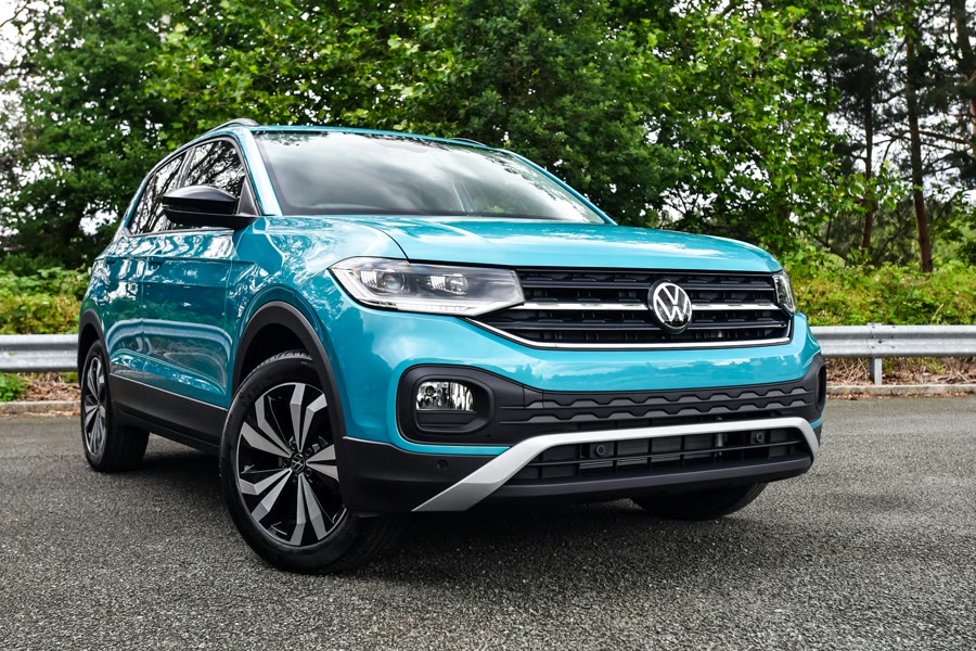 Tinting a family SUV: a blue compact SUV parked on a road