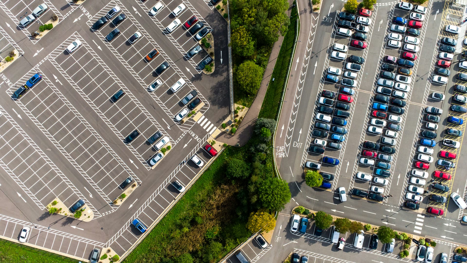 Car window tinting Morley: aerial view of a large shopping centre car park full of cars