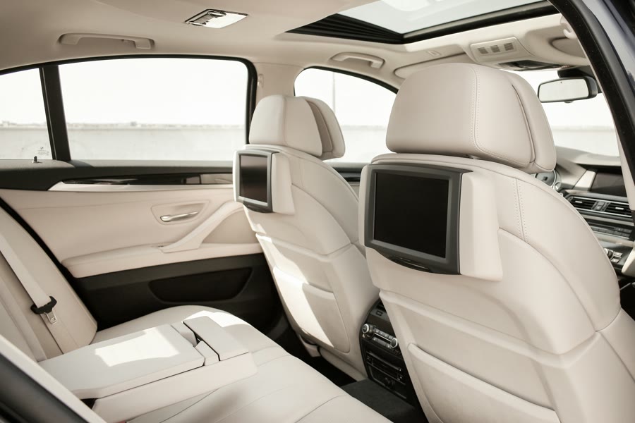 Protecting a prestige interior: cream leather rear seats lit through the windows