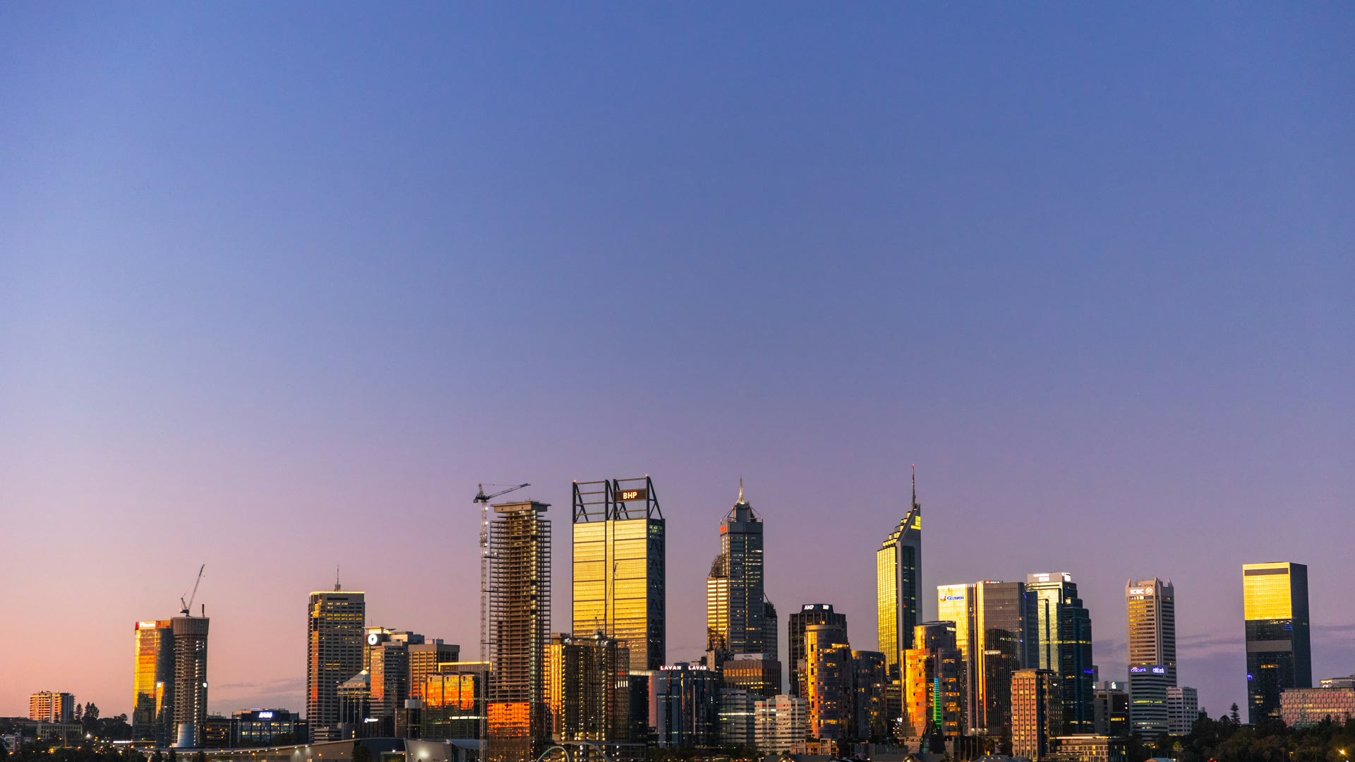 Car window tinting South Perth: the Perth city skyline across the Swan River at dusk