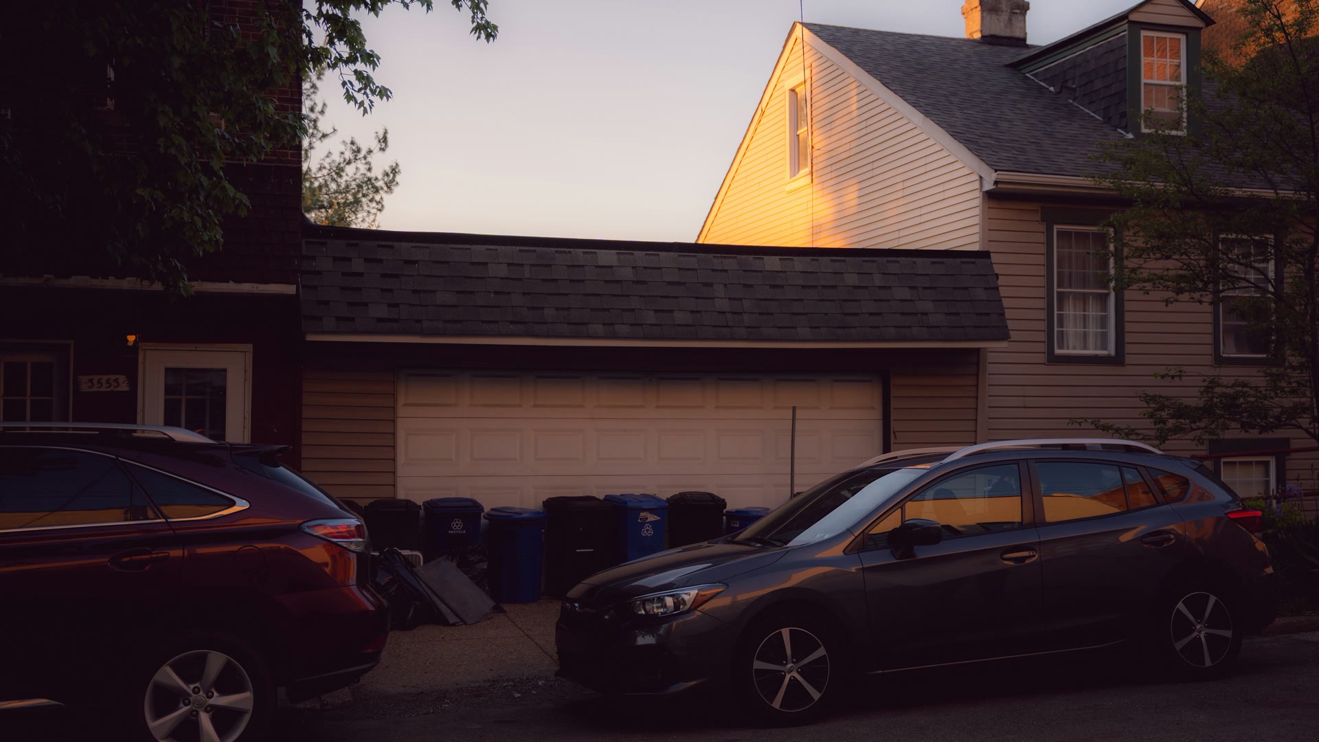 Car window tinting Victoria Park: a residential street lined with parked cars at sunset