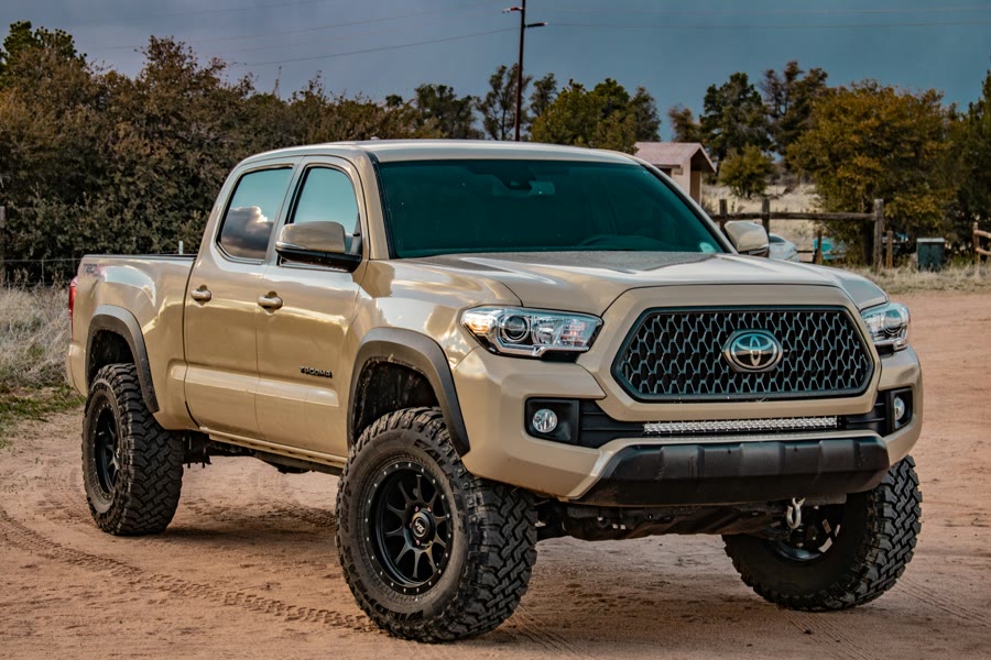 Quoting a ute for window tint: a tan dual-cab ute on a dirt track