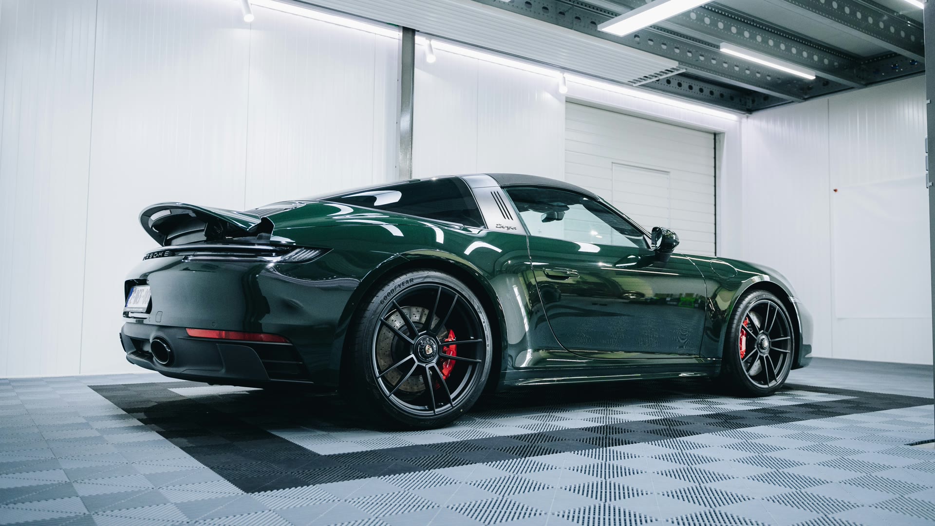 Ceramic coating Perth: green sports car with a deep gloss finish in a detailing studio