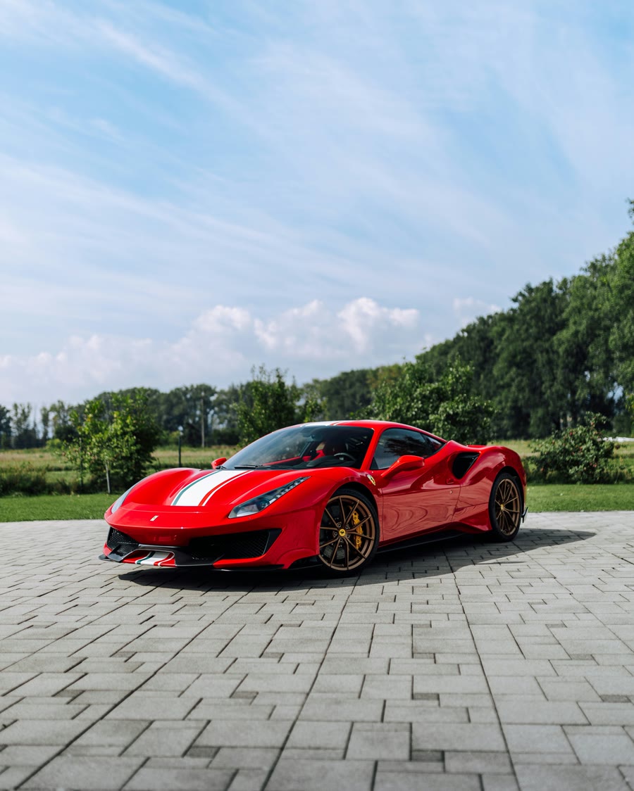 Colour-stable tinted windows on a red sports car, showing no purple fade